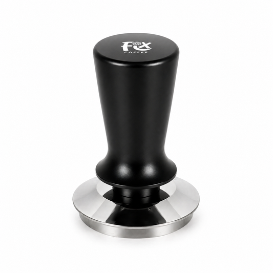 FIX COFFEE spring loaded tamper with a black faceted handle and polished stainless steel base