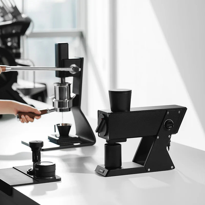 MHW-3BOMBER F74 Electric Coffee Grinder. Black finish. Precision grinding. Modern design. On a clean, white surface.