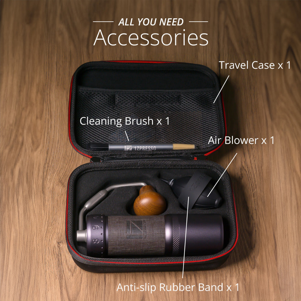 1Zpresso J-Ultra accessories in case: grinder, brush, blower, band. Silver and brown grinder. Open black travel case.