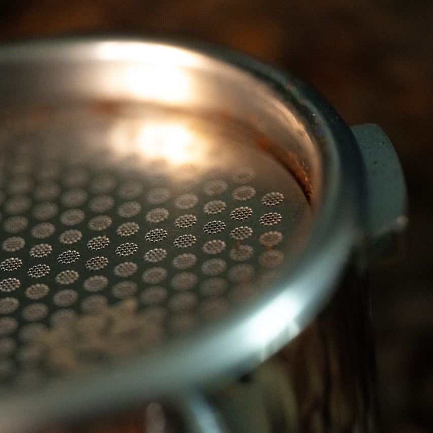 FIX COFFEE 58mm espresso puck screen, titanium plated. Close-up of fine mesh.