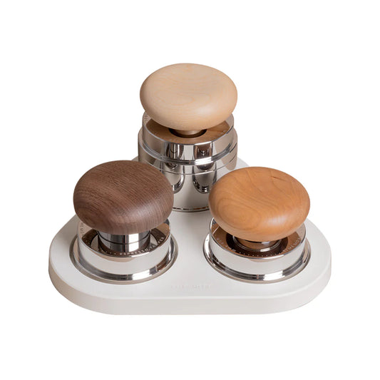 Tamper, WDT and Coffee Distributor with premium wooden tops and stainless steel bases on a white background