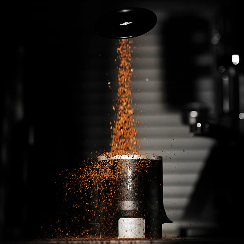 MHW-3BOMBER SE Pro espresso shaker funnel distributing coffee grounds. Close up.