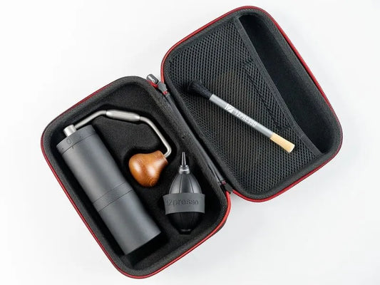 1Zpresso X-Ultra grinder kit. Gray grinder, cleaning brush, blower in red-trimmed case.