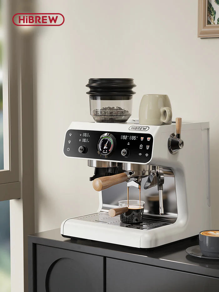HiBREW H7B espresso machine grinding coffee. White, with wooden accents. Coffee maker on counter.
