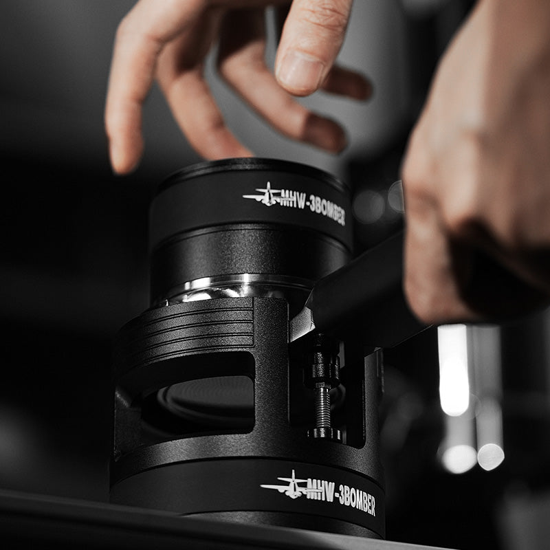 MHW-3BOMBER black portafilter holder with adjustable height feature being used. 