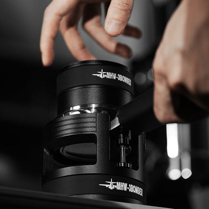 MHW-3BOMBER black portafilter holder with adjustable height feature being used. 