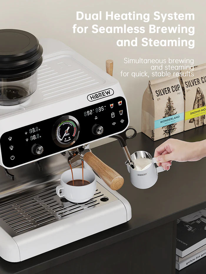 HiBREW H7B espresso machine brewing coffee. White appliance with wood accents. Cup and milk steaming pitcher visible.