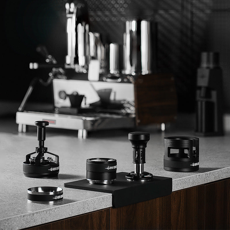 MHW-3BOMBER YU Series black coffee portafilter holder station. Adjustable height, silicone pads on counter.