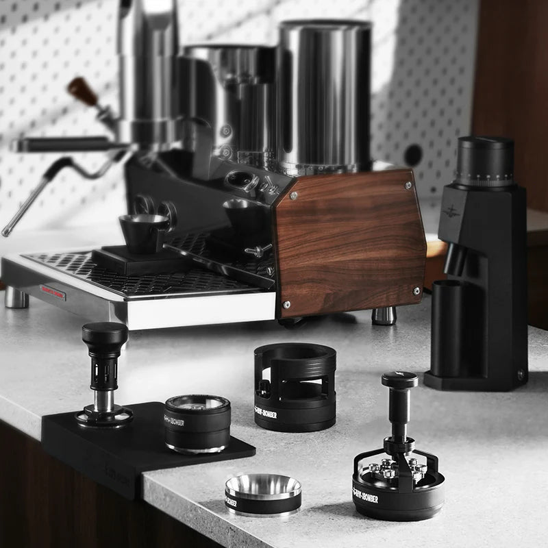 MHW-3BOMBER infinite coffee distributor and espresso machine on counter. Black, metal. 