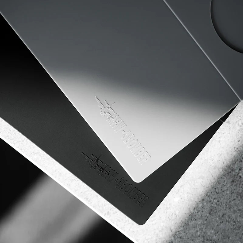 MHW-3BOMBER Tamping Base close-up. Gray silicone, with logo. Kitchen accessory for coffee preparation.