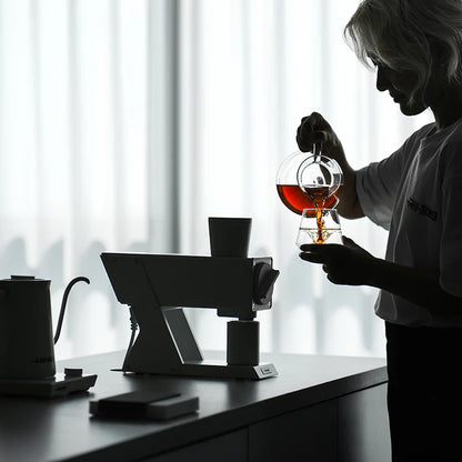 MHW-3BOMBER coffee grinder; white, electric, with person pouring tea. 