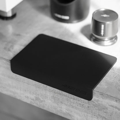 MHW-3BOMBER black silicone coffee tamper mat. Rectangular, protects counters. 