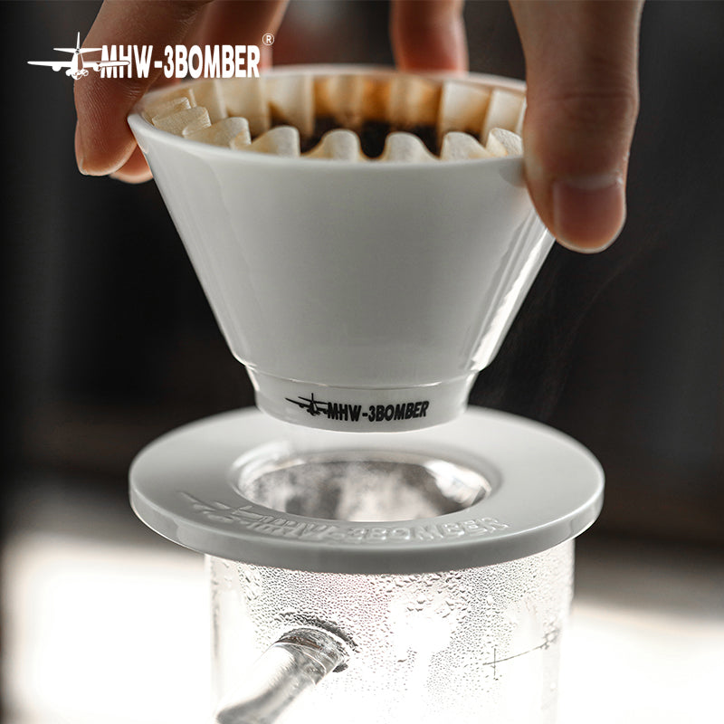 MHW-3BOMBER white ceramic Meteor Coffee Dripper, 1-2 person capacity, during brewing process.