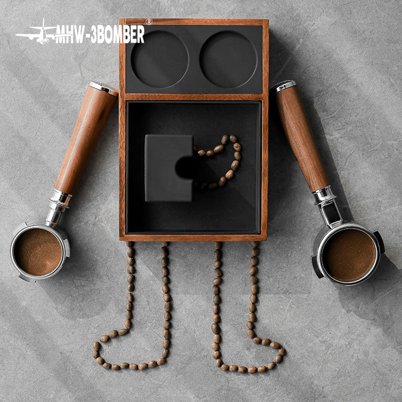 MHW-3BOMBER espresso tamping station with wood frame, portafilter holders, & coffee bean details. 