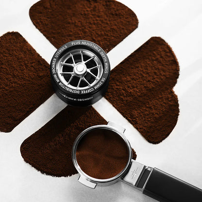 MHW-3BOMBER YU coffee distributor with adjustable depth, four leaf clover design and portafilter with ground coffee.