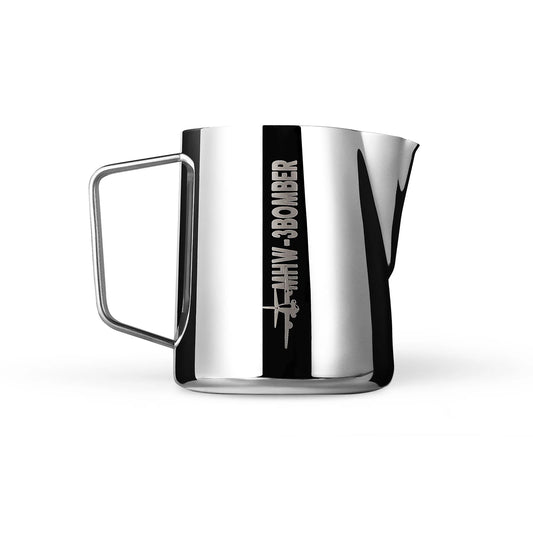 A glossy austenitic 304 stainless steel frothing pitcher from MHW-3BOMBER, featuring a crocodile spout and handle. The side is engraved with MHW-3BOMBER plus a bomber plane illustration.