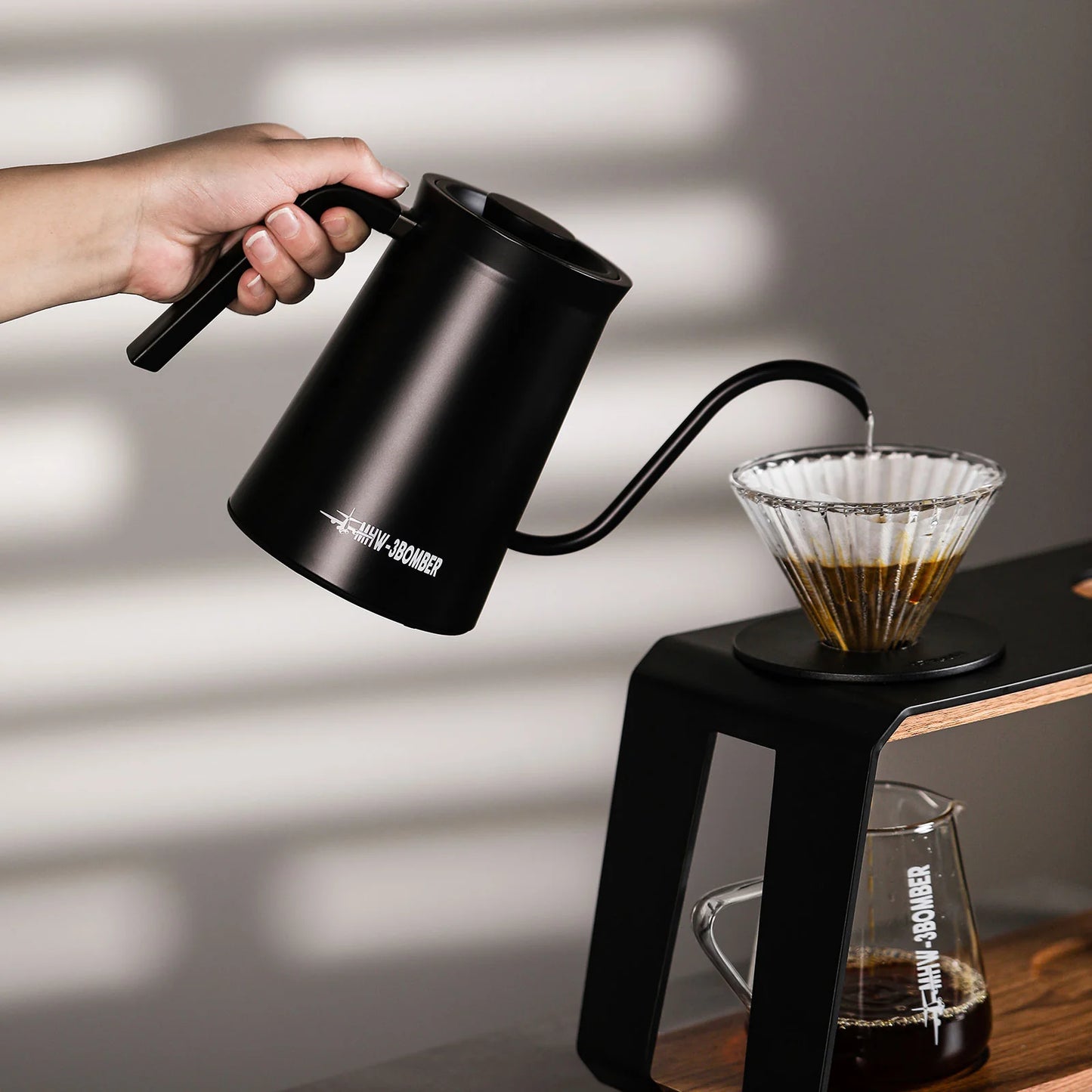 MHW-3BOMBER Assassin kettle being poured. Black gooseneck kettle with precise spout for brewing pour-over coffee.