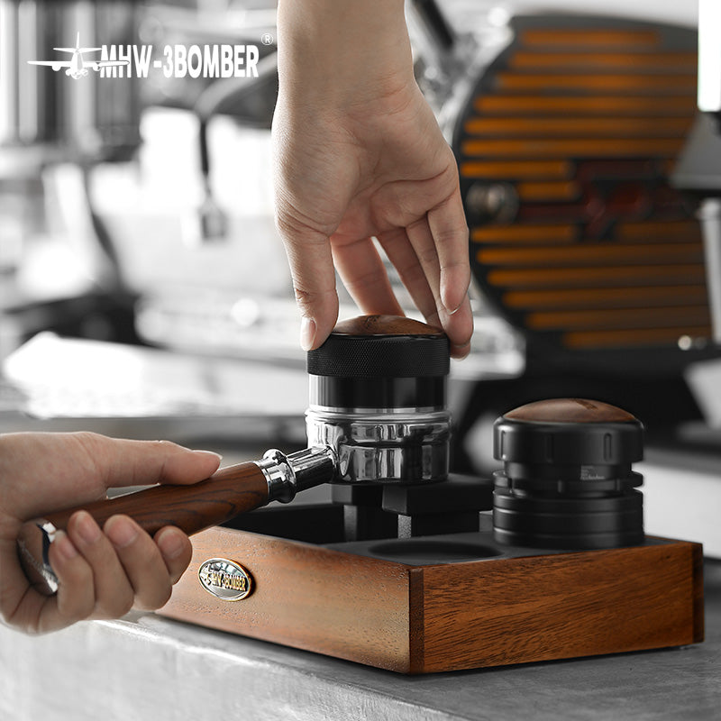 MHW-3BOMBER espresso tamping station, wood, holding portafilter, black tamper.