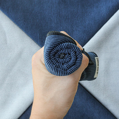 MHW-3BOMBER blue barista towel roll in hand. Textured weave. For coffee bar use. 