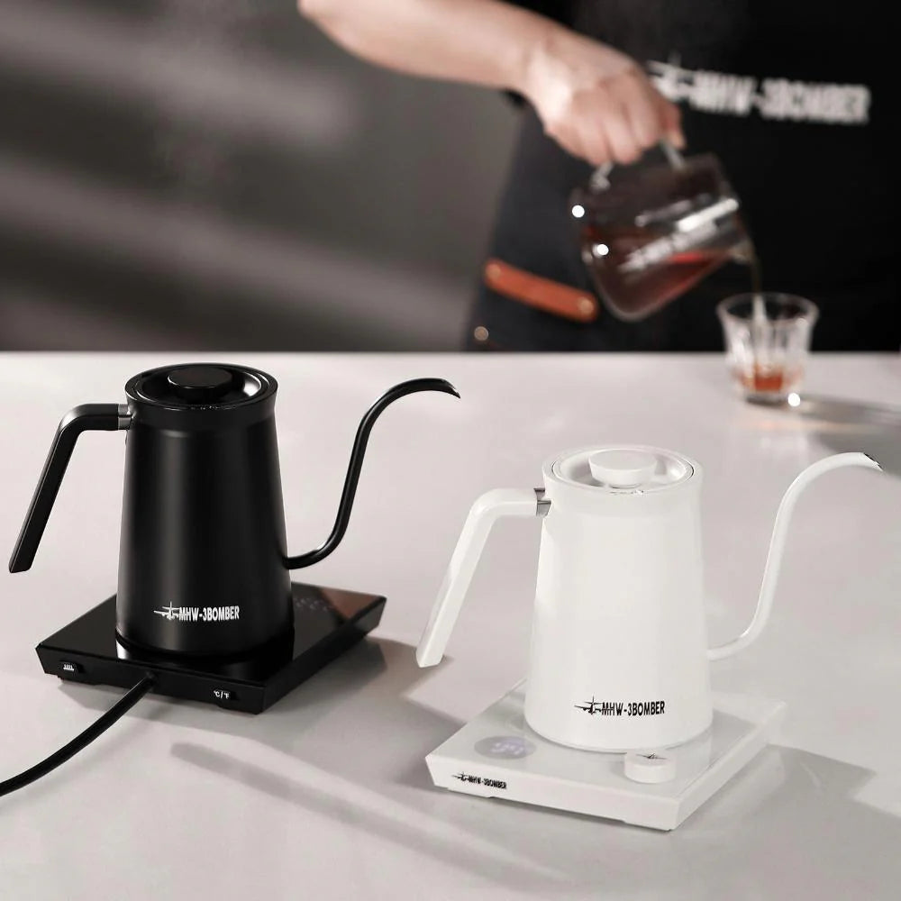 MHW-3BOMBER electric gooseneck kettles in black and white. Pour-over coffee kettle with temperature control on counter.