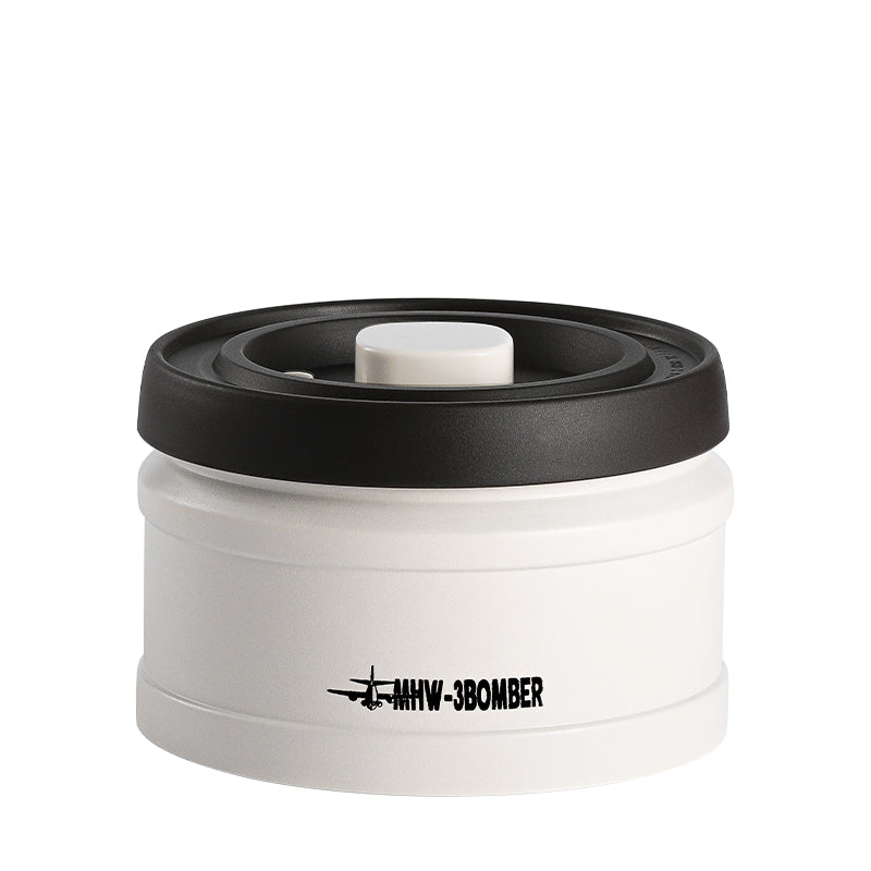 MHW-3BOMBER white coffee vacuum canister with black lid. Keeps beans fresh longer.