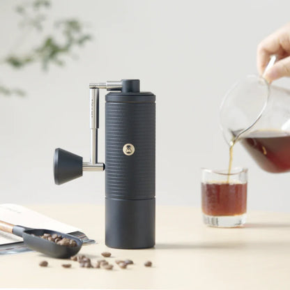 TIMEMORE Chestnut C5 Pro Esp manual grinder on a coffee counter
