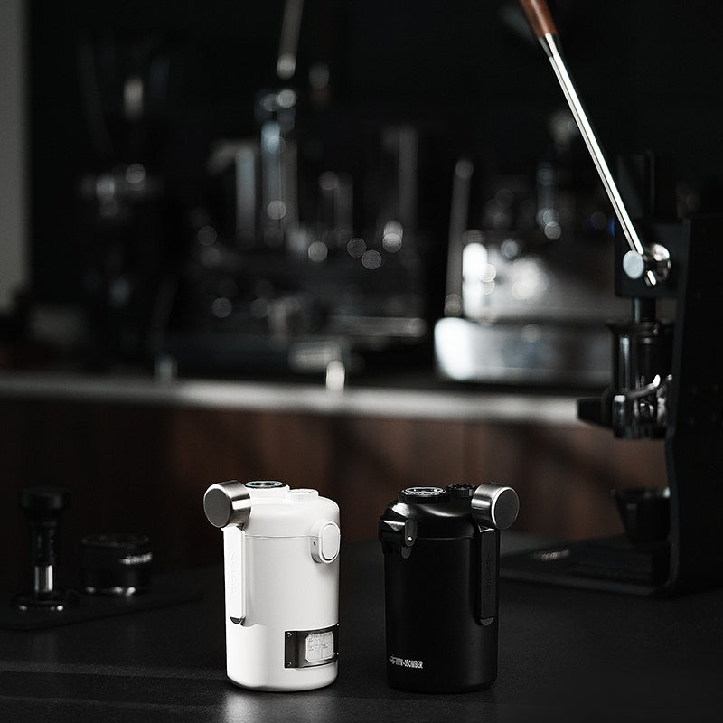 MHW-3BOMBER Gambo sealed coffee canisters in white and black on a counter. 