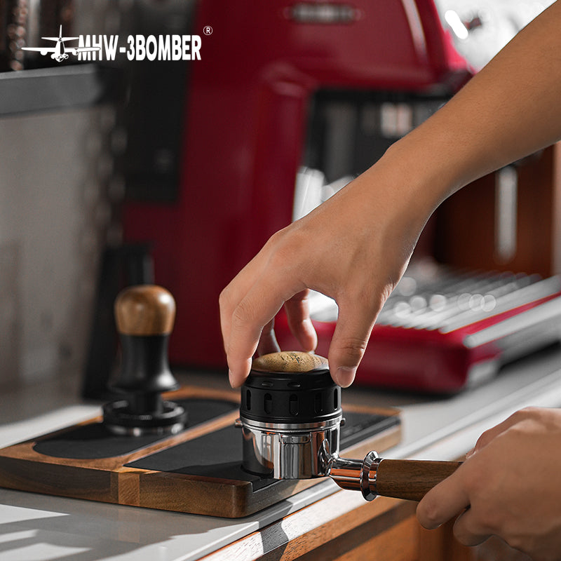 MHW-3BOMBER Falcon coffee distributor being used. Stainless steel and black finish.