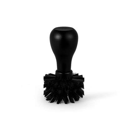Black portafilter cleaning brush with round handle, part of Daily Cleaning Essentials Kit. 