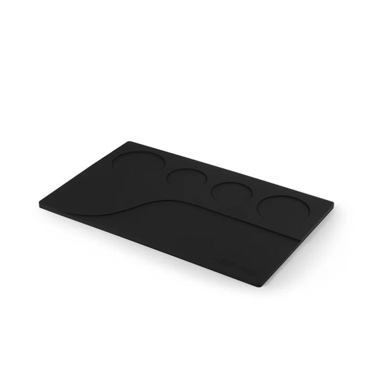 MHW-3BOMBER black silicone tamping base with portafilter and tool slots. Organizes espresso accessories.