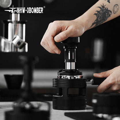 MHW-3BOMBER 58mm black espresso tamper in use. Force Impact design. Premium coffee tamping tool.