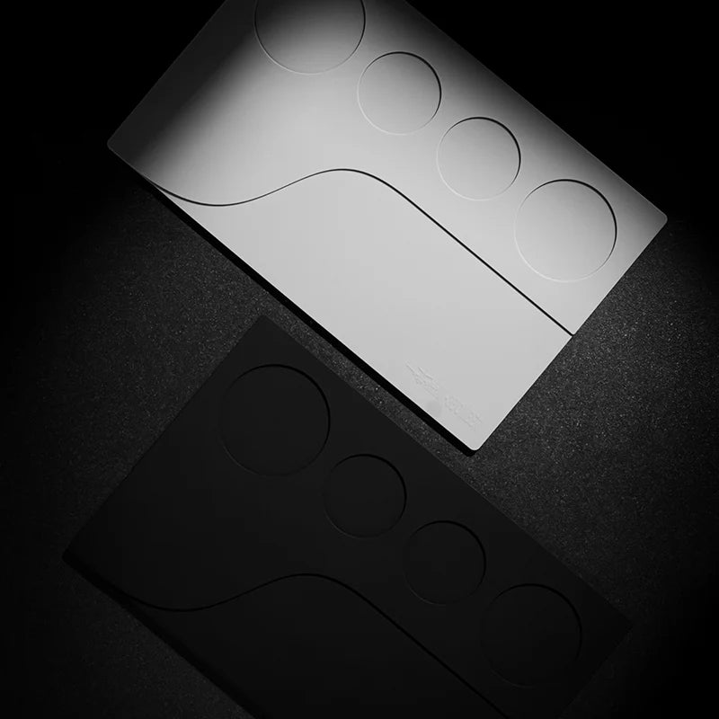MHW-3BOMBER YU Series Tamping Base. Silicone tamping base with portafilter, dosing funnel and WDT slots. Black and White.
