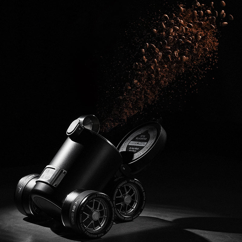 MHW-3BOMBER black coffee canister with car wheel design and bean exhaust. 