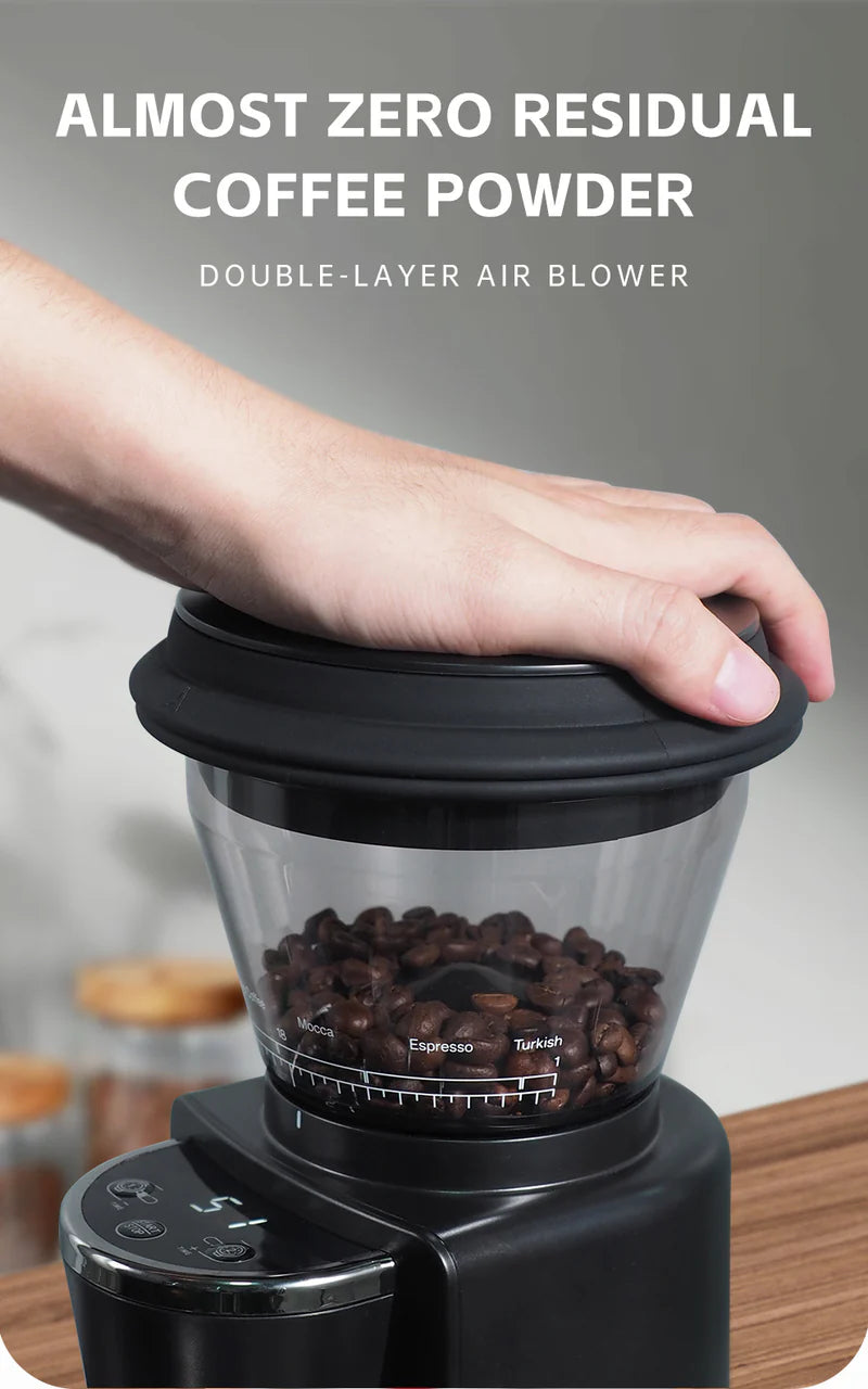 The Fix Coffee HiBREW G3 40mm Conical Burr Electric Coffee Grinder is operated by hand, showcasing its burr design with visible coffee beans. It features Almost Zero Residual Coffee Powder, a Double-Layer Air Blower, and clearly labeled adjustable grind settings for precise brewing.