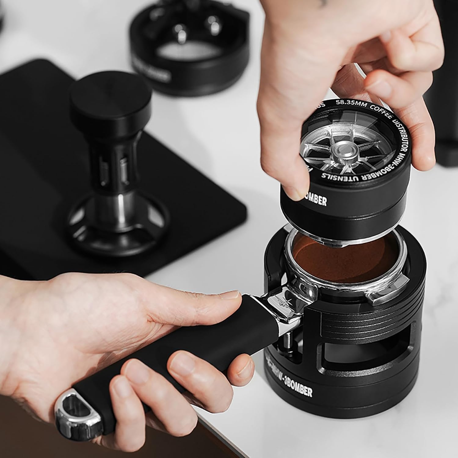 Person using a coffee grinder with a focus on the action of grinding coffee beans.
