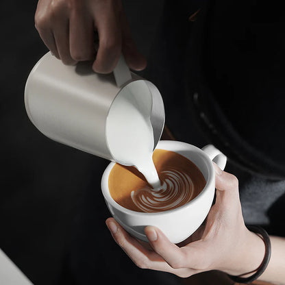 MHW-3BOMBER GT Milk Pitcher glossy white being used to create latte art.