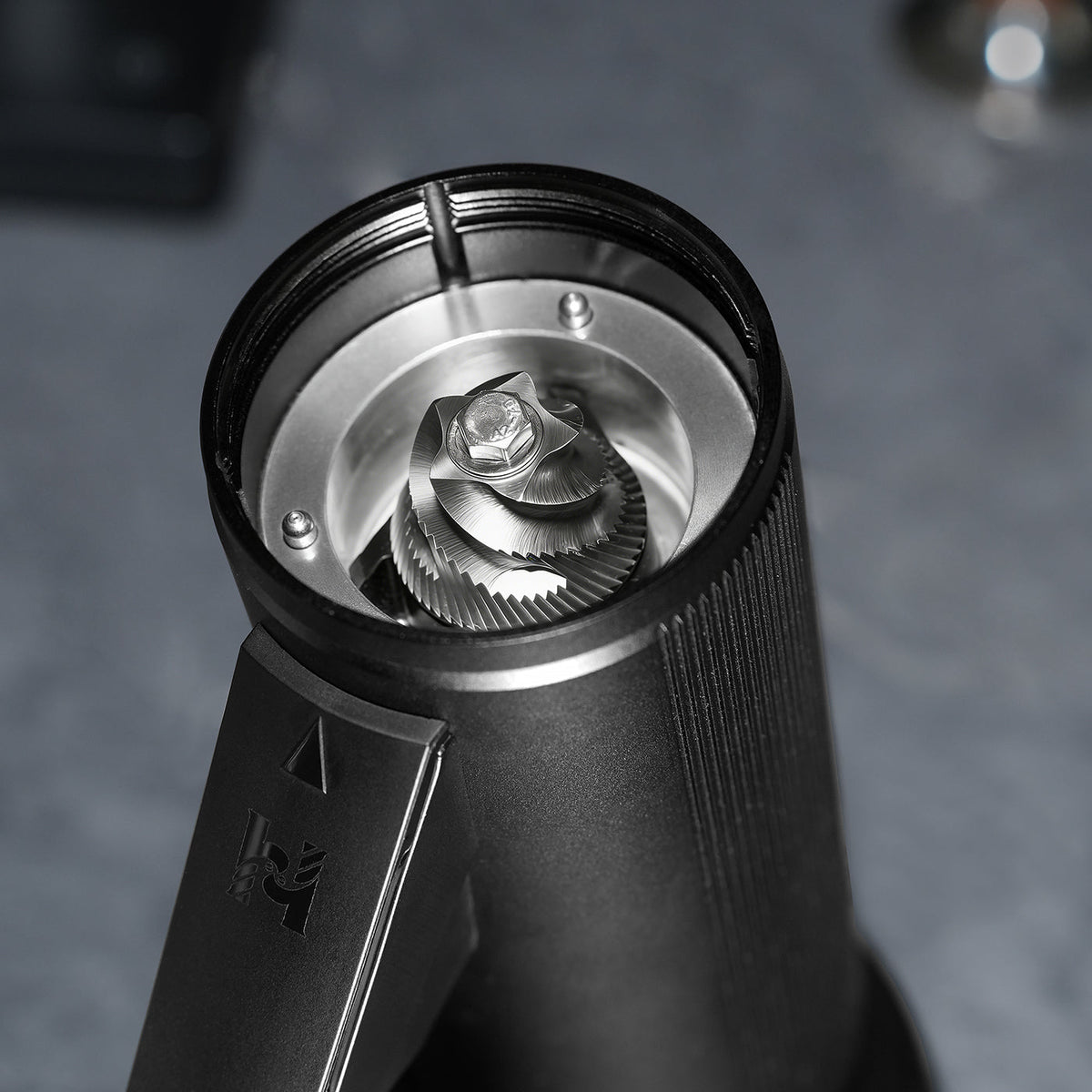Top-down view into the HiBREW G5 Plus burr chamber showing the 48mm stainless-steel conical burr.