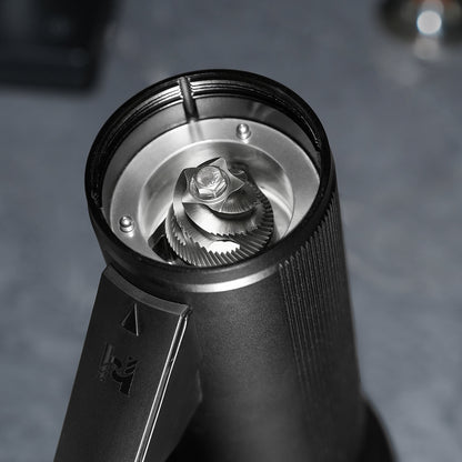 Top-down view into the HiBREW G5 Plus burr chamber showing the 48mm stainless-steel conical burr.
