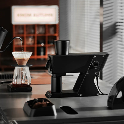 MHW-3BOMBER F74 Navigator coffee grinder. Black, stepless adjustment, and vertical chute design on counter. 