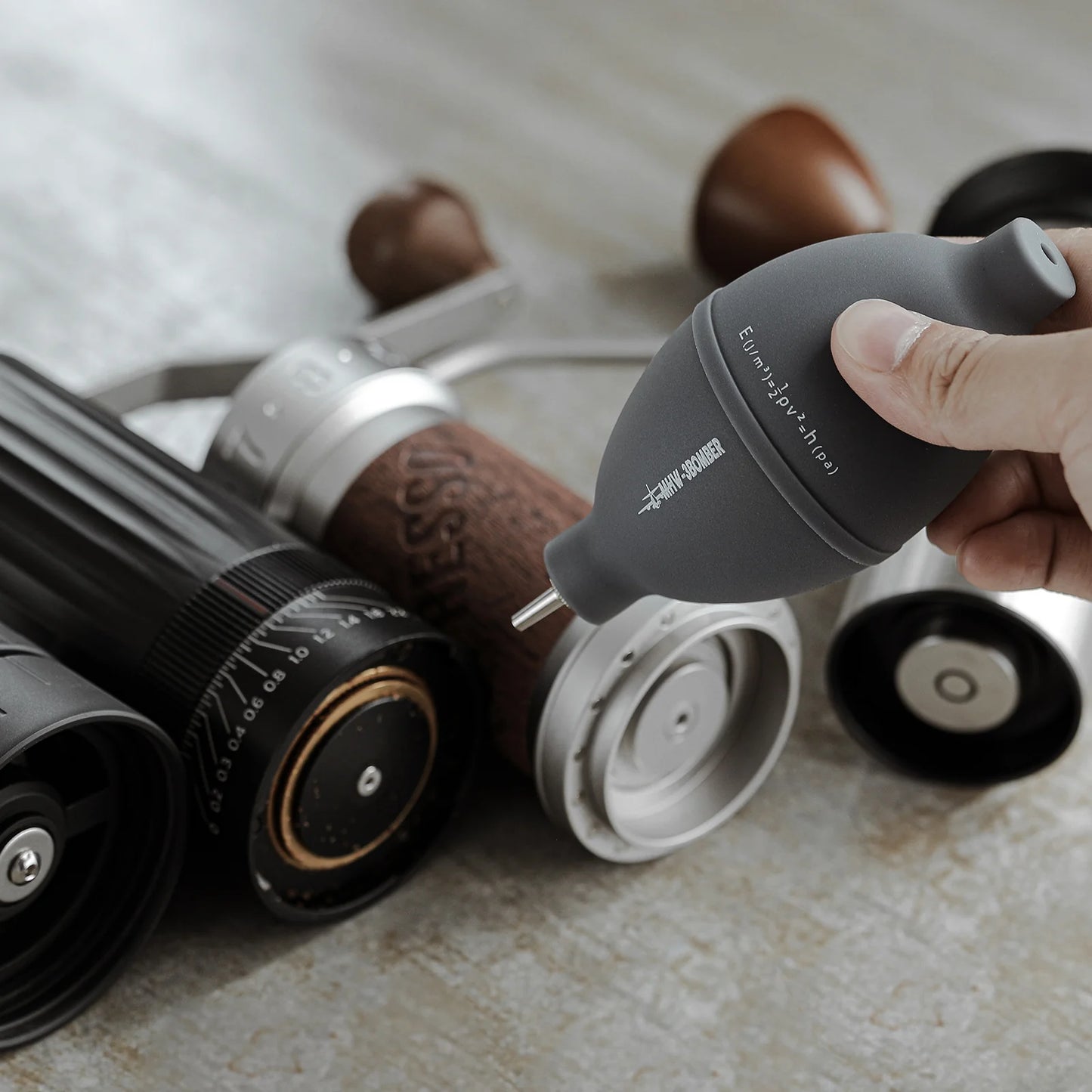MHW-3BOMBER gray air blower cleaning a coffee grinder. Small nozzle. 