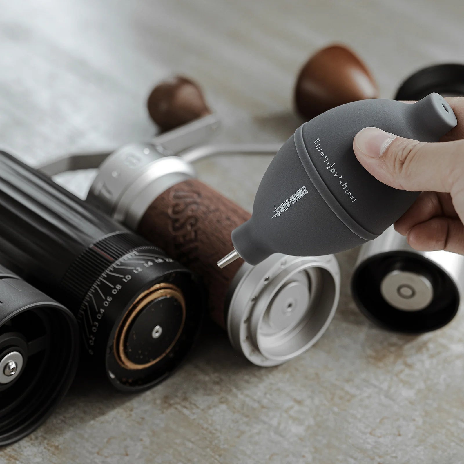 MHW-3BOMBER gray air blower cleaning a coffee grinder. Small nozzle. 