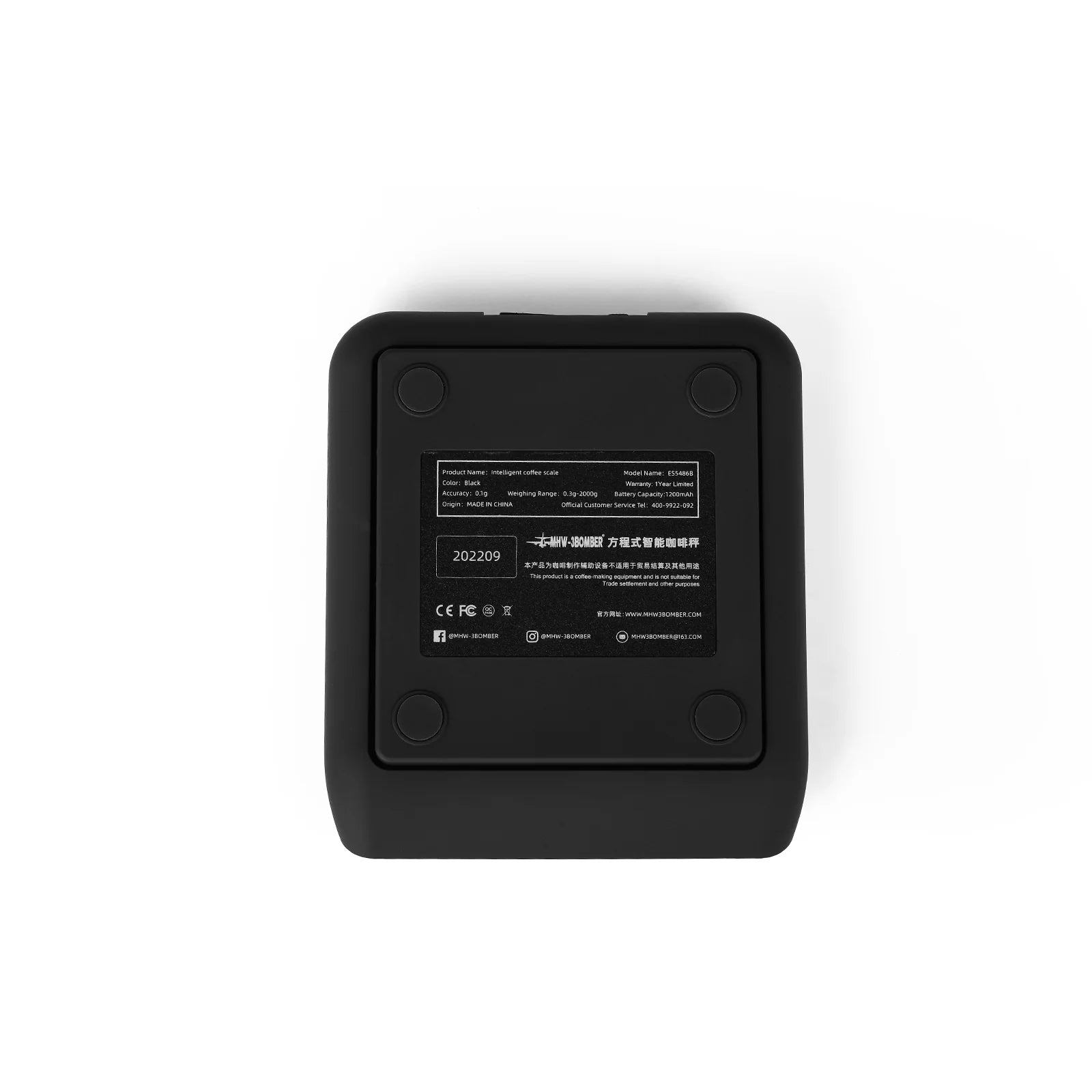 Bottom view of a black MHW-3BOMBER smart coffee scale showing the information label and rubber feet.