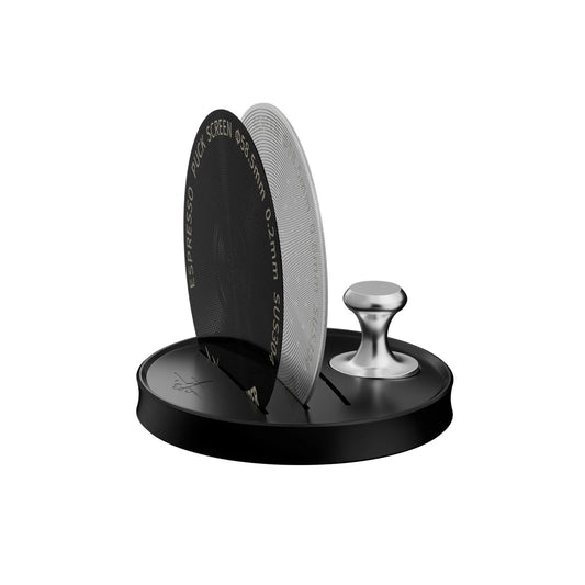 The MHW-3BOMBER Espresso Puck Screen Stand 51-58mm is a round, black coffee accessory with a silver handle and magnetic design. It features two vertical slots for circular components, including a espresso puck screen disk thats 0.2mm thick and 58.5mm in size, offering convenient organization.