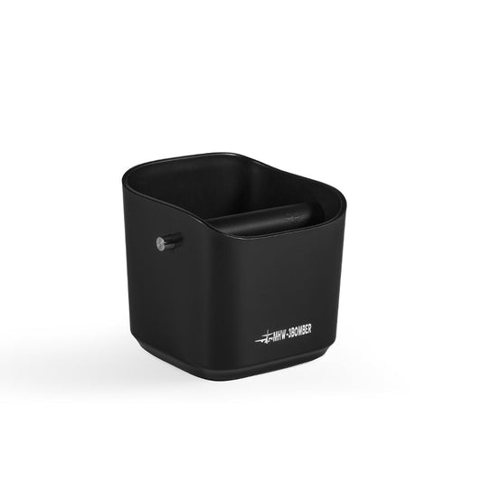 A sleek black MHW-3BOMBER Coffee Espresso Square Knock Box resembles a durable container with a padded handle inside, labeled HWI-380VB3. Its modern design and slightly curved shape make it easy to clean and stylish against a plain white background.