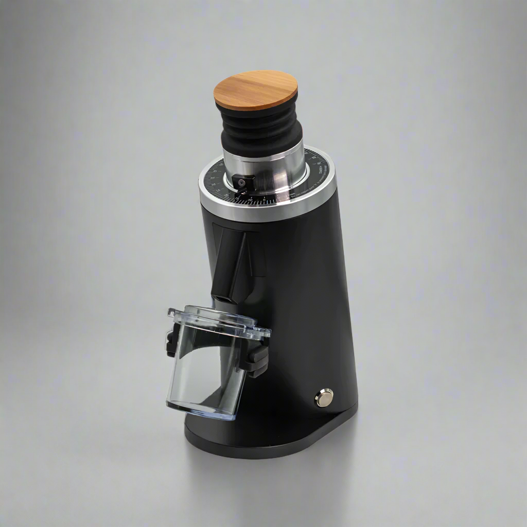 The DF54 - 54mm Flat Burr Coffee Grinder by Fix Coffee is sleek and modern, featuring a black cylindrical body with a wooden top and transparent container. Its tailored for home baristas seeking precision, with a control dial near the top, embodying elegance against any backdrop.