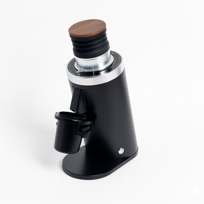 Black coffee grinder with wooden top on a white background
