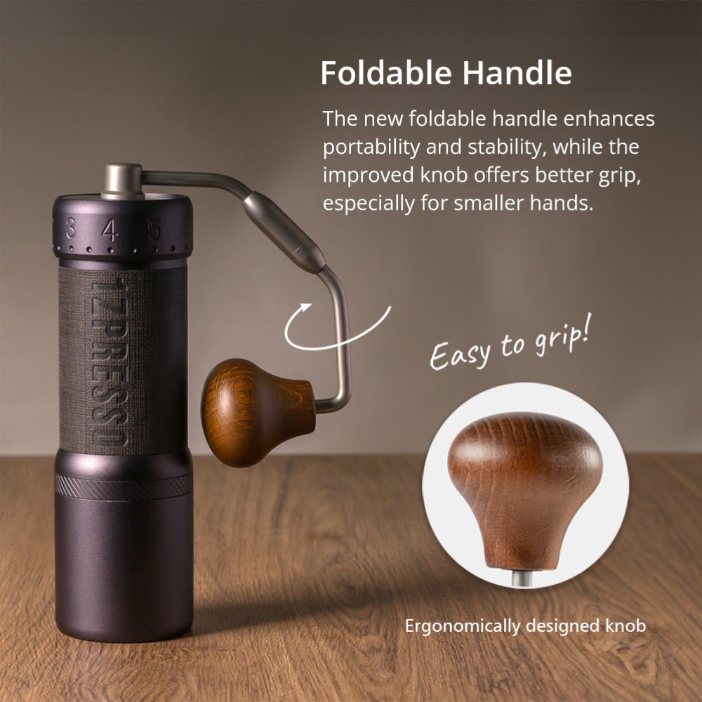 1Zpresso J-Ultra coffee grinder with foldable handle and ergonomic wood knob, purple/black body on wood surface.
