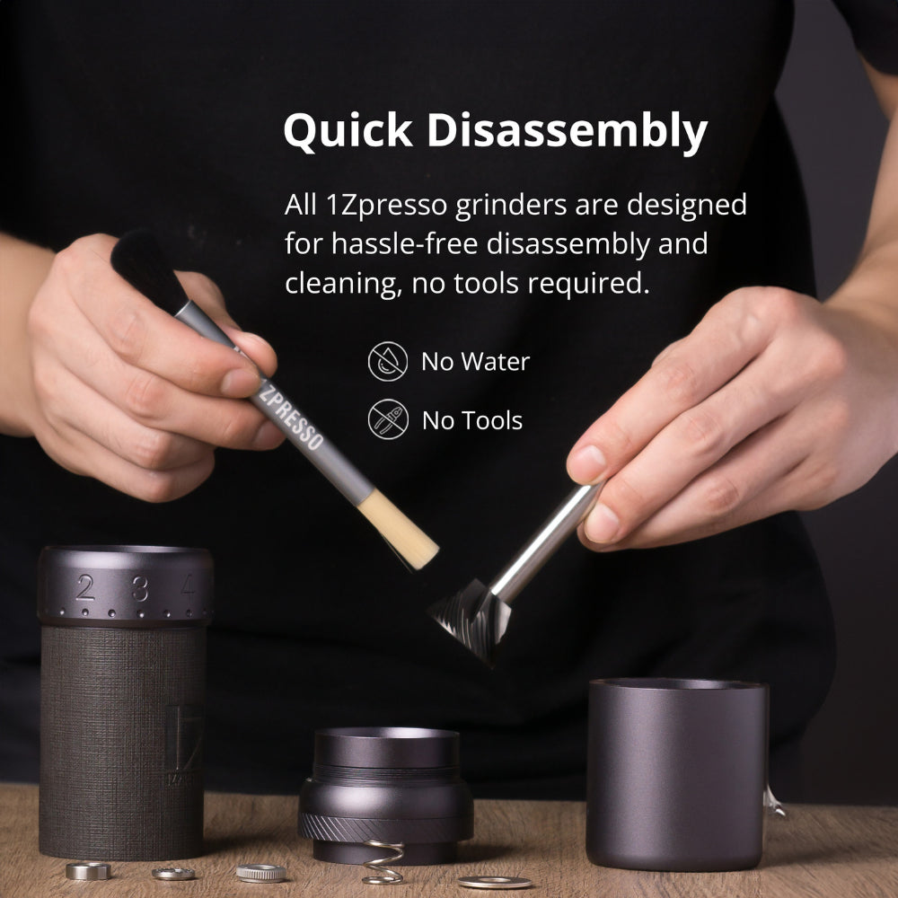 1Zpresso J-Ultra disassembled for cleaning, showing burrs and brushes. Gray metal parts. Easy, no-tool maintenance.