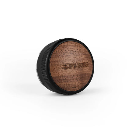 MHW-3BOMBER coffee distributor with a black, textured edge and a brown wood grain lid featuring the brand logo.
