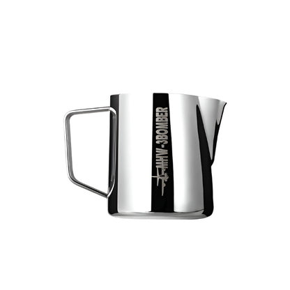 This 400ml silver MHW-3BOMBER Latte Art Pitcher 5.0 Glossy, made from glossy 304 stainless steel, features an etched MIW BOMBER logo on its side, a sturdy handle, and a crocodile spout for precise pouring.